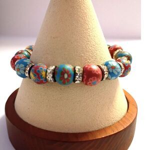 Bracelet of Rubber Flower beads Red and Blue floral patterns, Rhinestone spacers